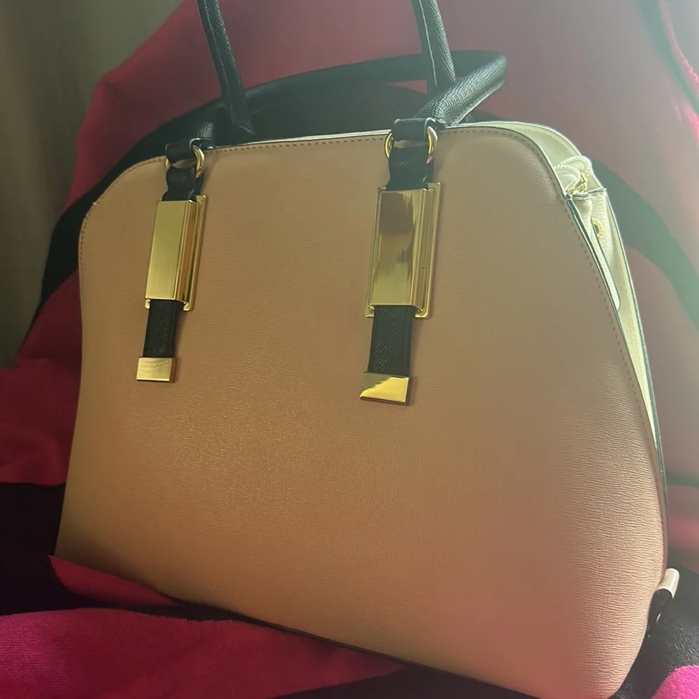 Tote style purse never used. Purse still has its original shape. - Picture 2 of 6